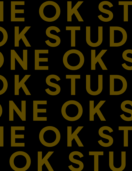 One Ok Studio team working on creative digital projects in a modern workspace